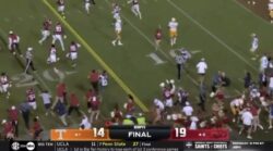 Arkansas fans storm the field after upsetting No. 4 Tennessee.